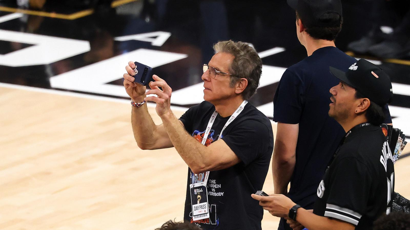 PHOTO: Ben Stiller records a video during the third quarter in Game Five of the 2026 NBA Finals between the San Antonio Spurs and the New York Knicks at Frost Bank Center, on June 13, 2026, in San Antonio, Texas.