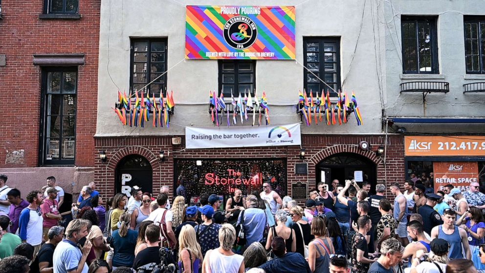 PHOTO: People gather outside the Stonewall Inn to mark the 50th anniversary of the Stonewall Riots in New York, June 28, 2019. 