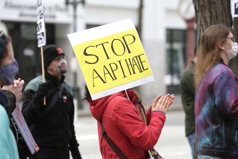 PHOTO: A demonstrator holds a sign calling for a stop to hate against Asian Americans and Pacific Islanders during a national day of action against anti-Asian violence in Seattle, Wash.,March 27, 2021. 