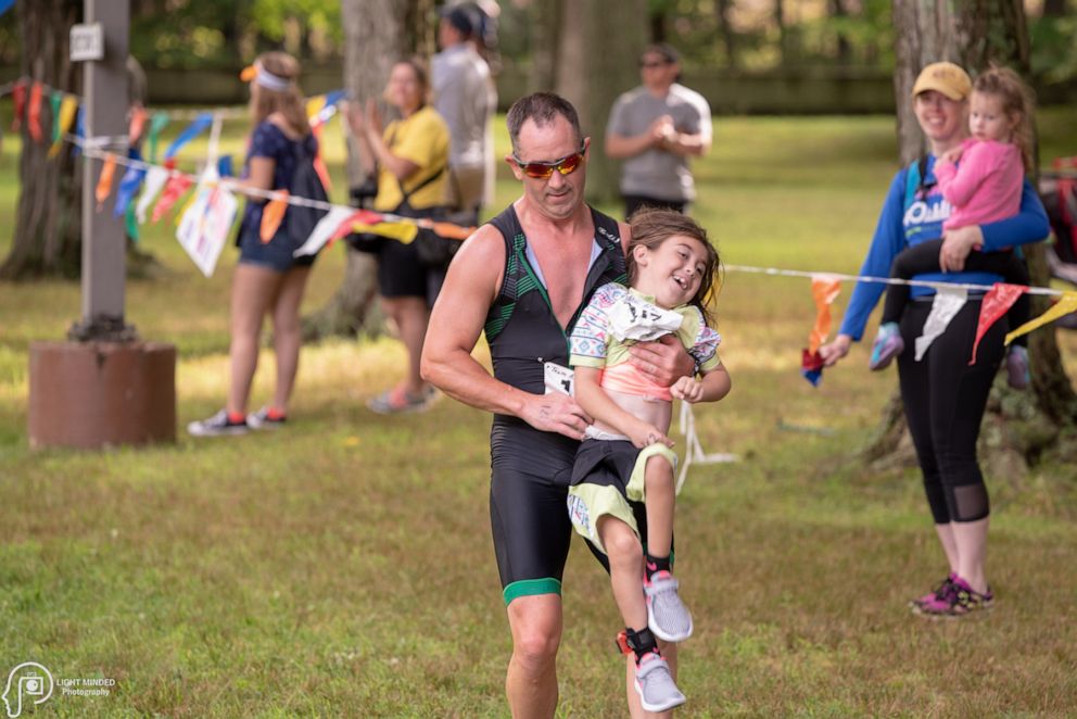 PHOTO: Abby MacCurtain, 9, and her dad Greg MacCurtain of Plymouth, Massachusetts, participate in triathlons together.
