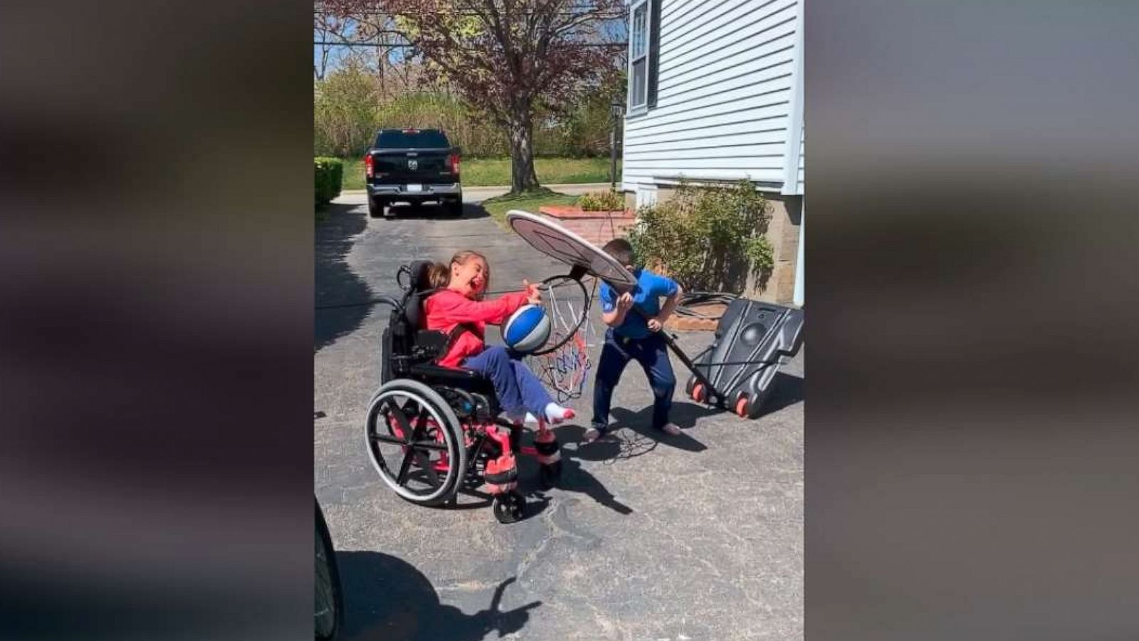 PHOTO: Millions were moved in May 2020 by a video of 8-year-old Tomas MacCurtain helping his sister Abby MacCurtain, 9, slam dunk a basketball. Dad Greg MacCurtain of Plymouth, Massachusetts, posted the sweet footage of his kids onto Facebook.