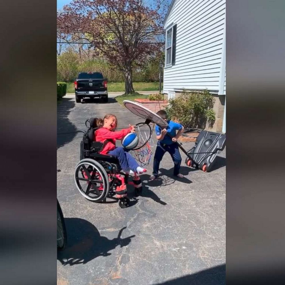 VIDEO: The story behind the viral video of a brother helping his sister dunk a basketball