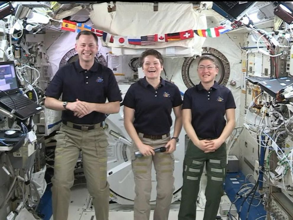 PHOTO: Astronauts Nick Hague, Anne McClain, center, and Christina Koch speak on board the International Space Station.
