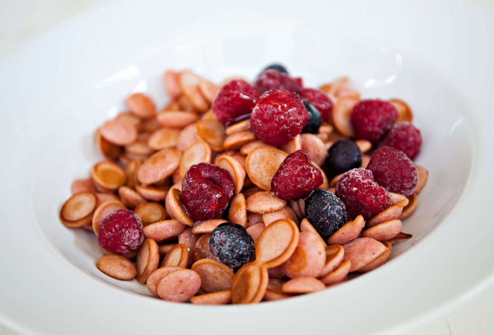 PHOTO: Nguyen adds frozen berries to her strawberry pancake cereal.