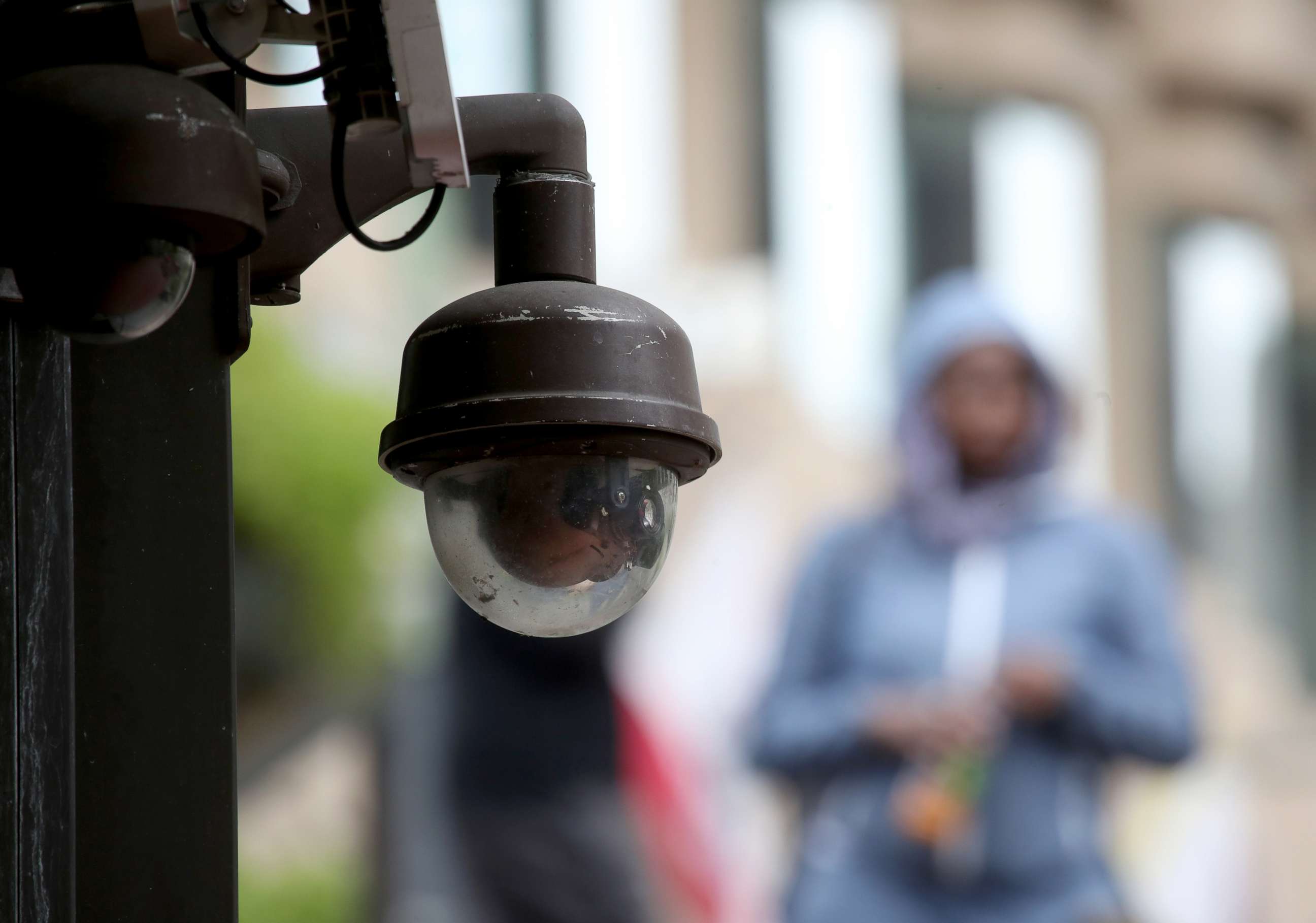 PHOTO: A video surveillance camera hangs from the side of a building, May 14, 2019, in San Francisco, California.