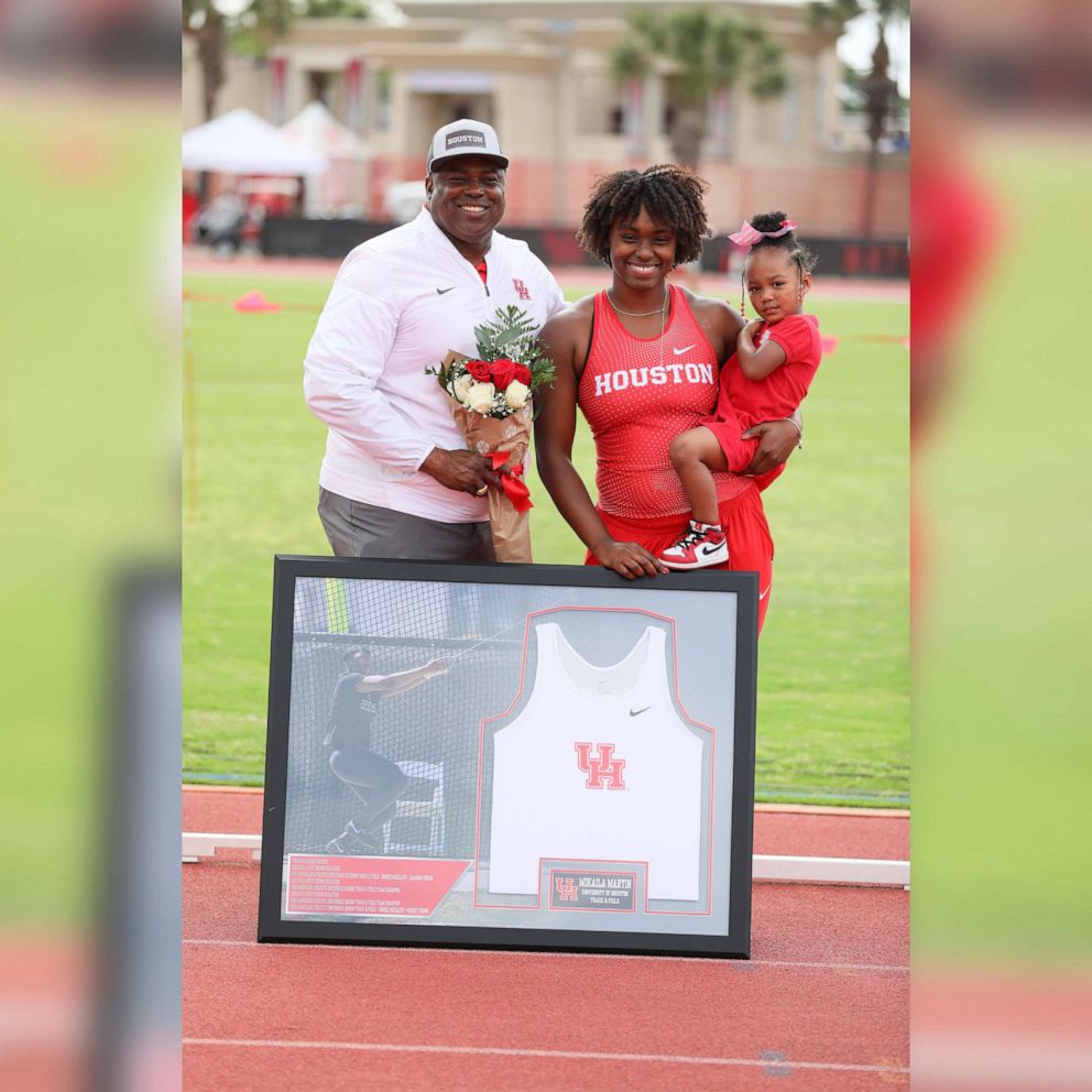 PHOTO: Mikaila Martin poses for a photo with her daughter Camryn and University of Houston Track & Field head coach Leroy Burrell.