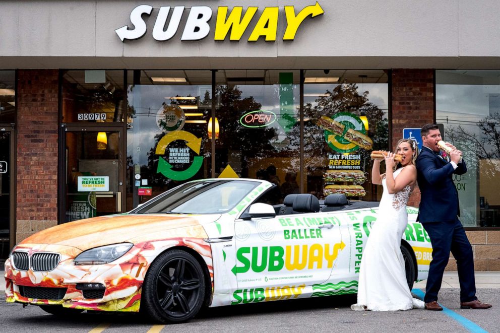 PHOTO: Julie Williams, 29, and Zack Williams, 34, pose in front of the Subway restaurant where they met on their wedding day.