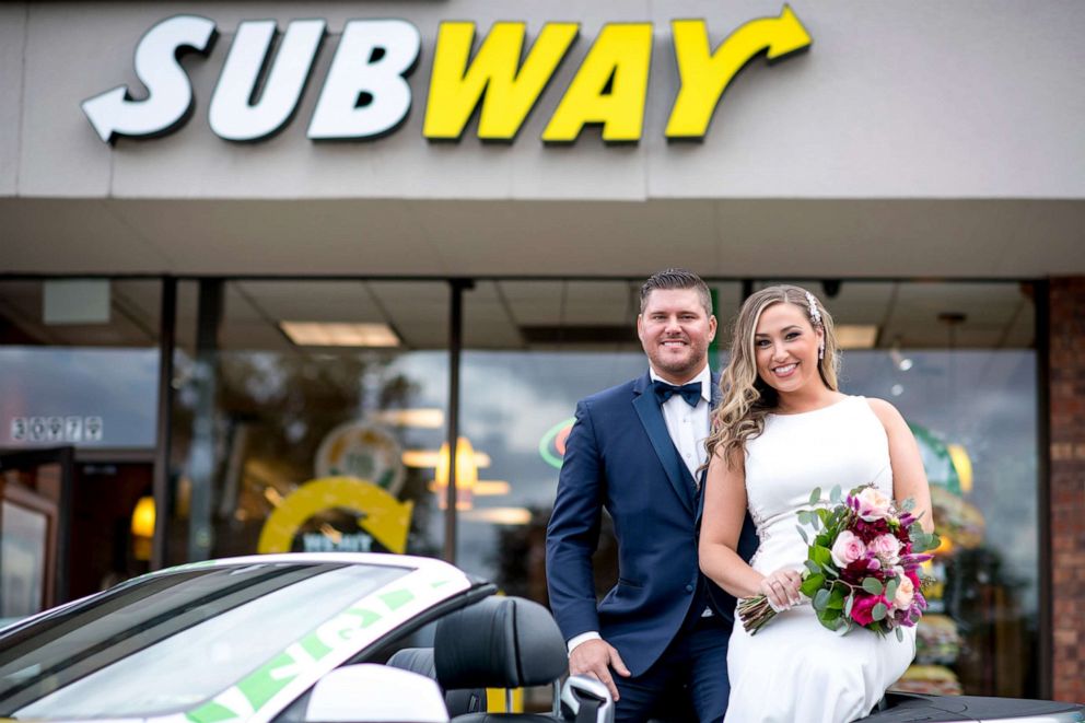 PHOTO: Julie Williams, 29, and Zack Williams, 34, pose in front of the Subway restaurant where they met on their wedding day.