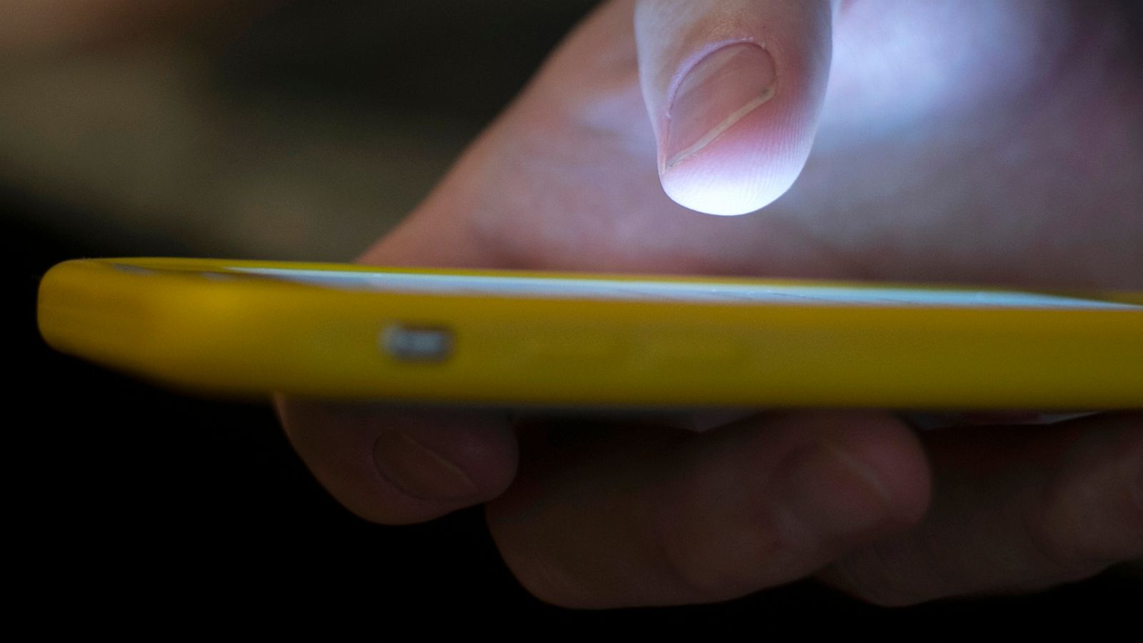 PHOTO: A man uses a cell phone in New Orleans, Aug. 11, 2019.