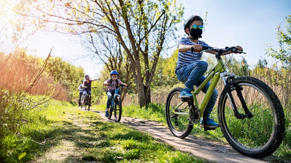 PHOTO: A mother and kids are enjoying a bike trip together during the COVID-19 pandemic.