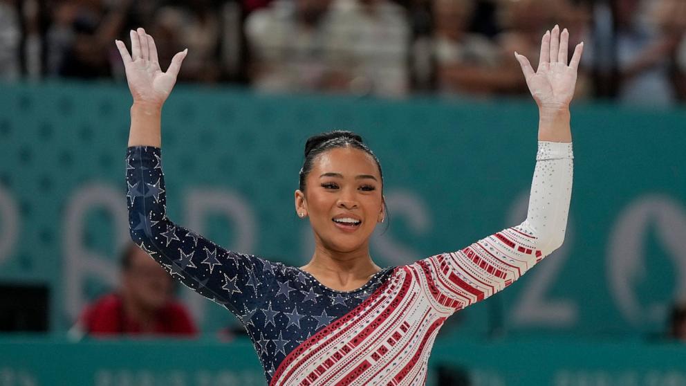 PHOTO: Suni Lee, of the United States, celebrates after performing on the balance beam during the women's artistic gymnastics team finals round at Bercy Arena at the 2024 Summer Olympics, July 30, 2024, in Paris, France.