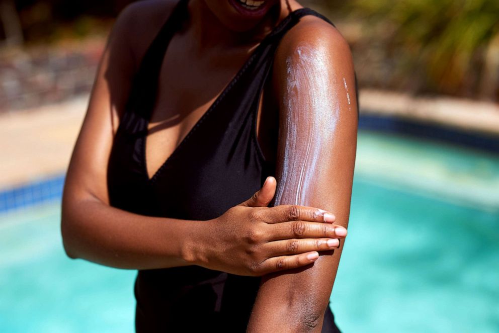 PHOTO: Stock photo of a woman applying sunscreen.