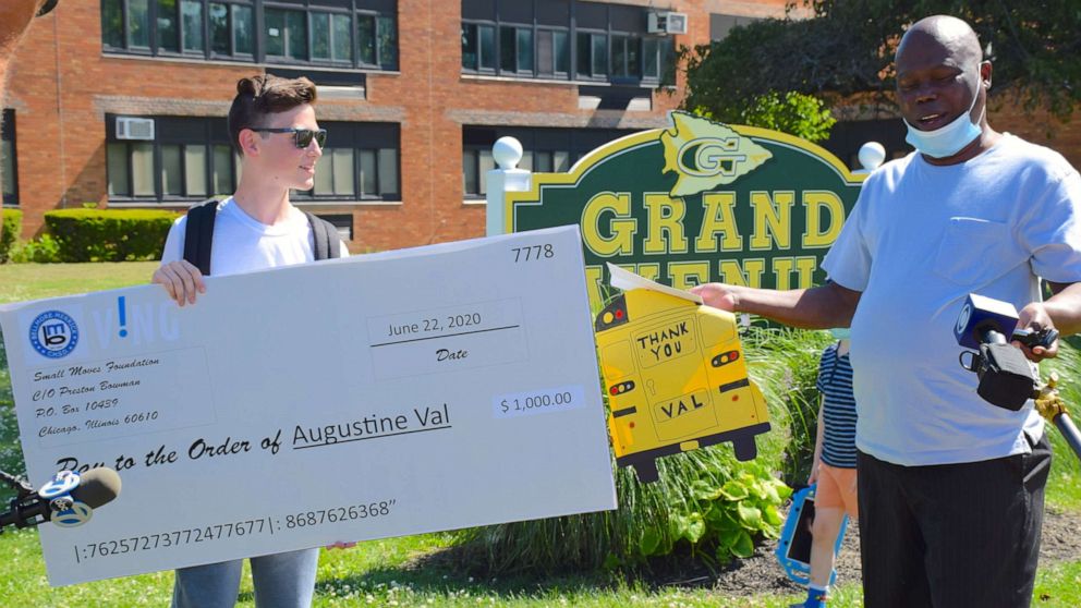 PHOTO: Grand Avenue Middle School graduate Preston Bowman surprised his school bus driver Agustine Val with a $1,000 check from the VING project in Long Island, New York.