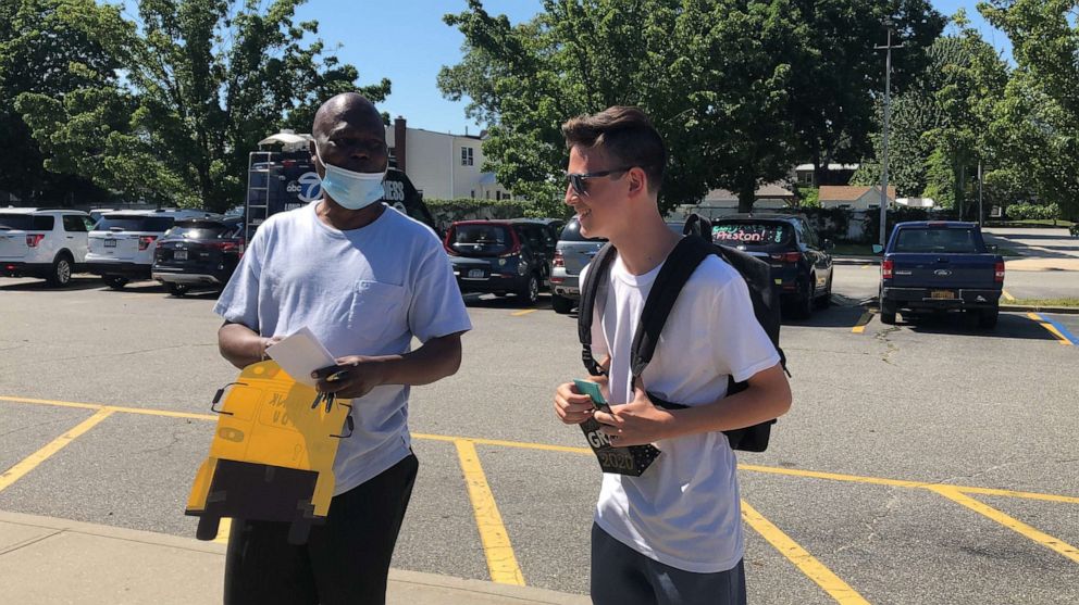 PHOTO: Grand Avenue Middle School graduate Preston Bowman surprised his school bus driver Agustine Val with a $1,000 check from the VING project in Long Island, New York.