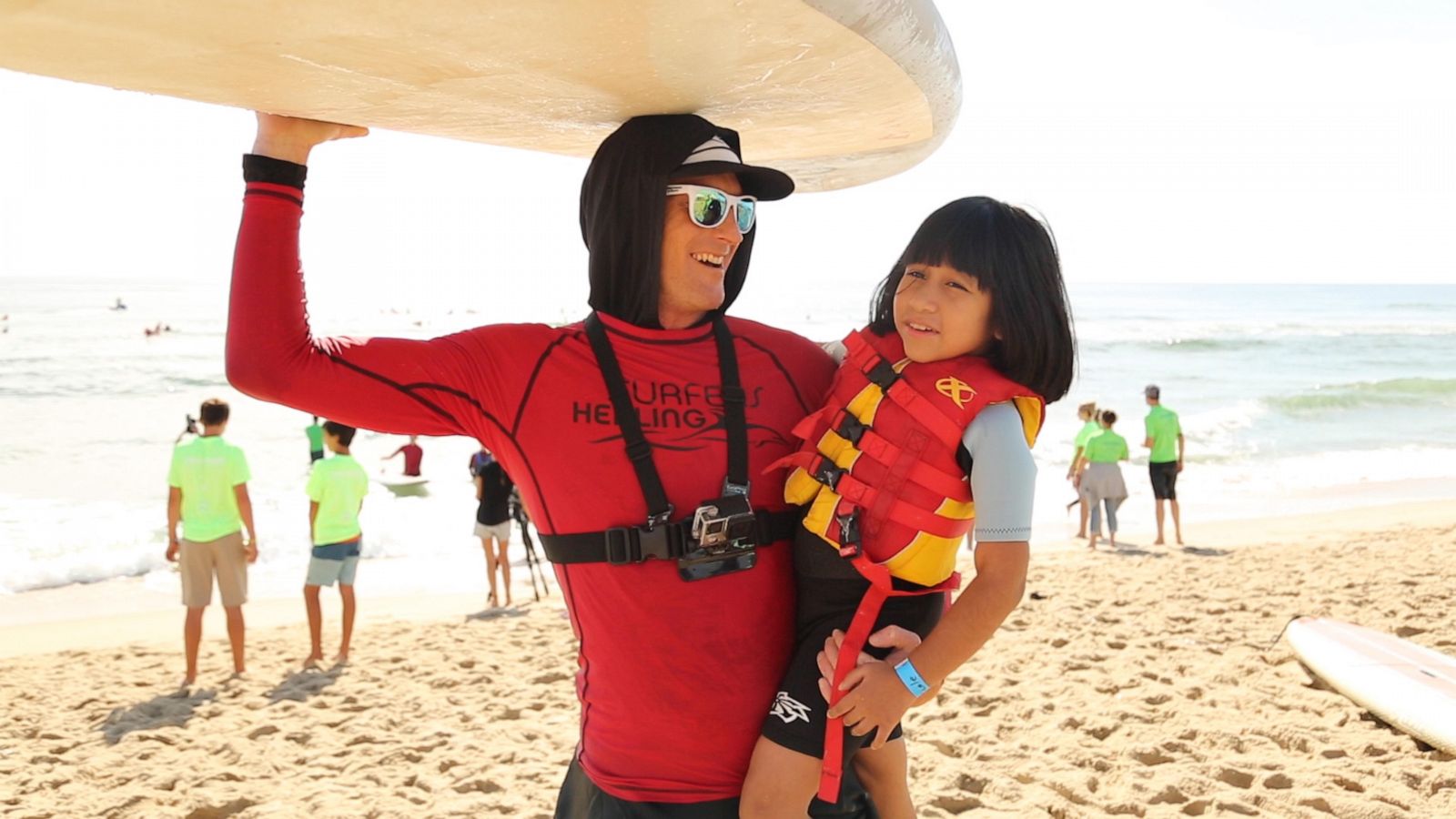 PHOTO: Surfers Healing volunteer Mikey O'Shaughnessy teaches dozens of kids with autism how to surf.