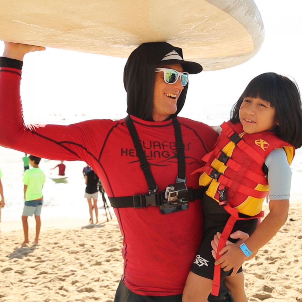 VIDEO: These pro surfers are using their sport to help kids with autism 