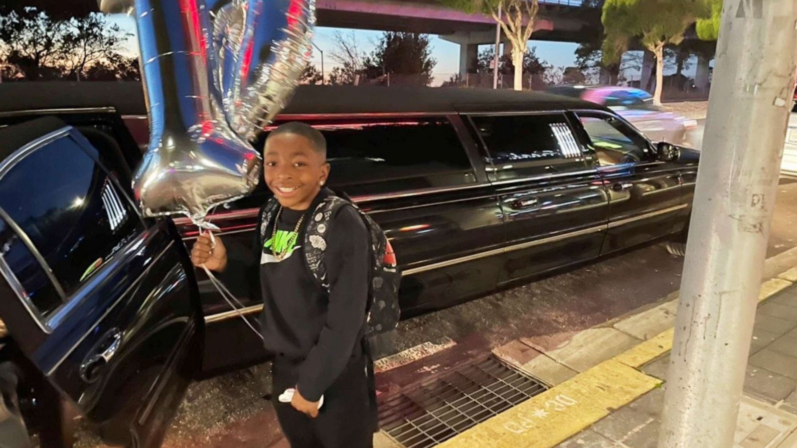 PHOTO: Dante Johnson poses outside the surprise limo that picked him up for his 10th birthday in San Francisco, Jan. 27, 2022.