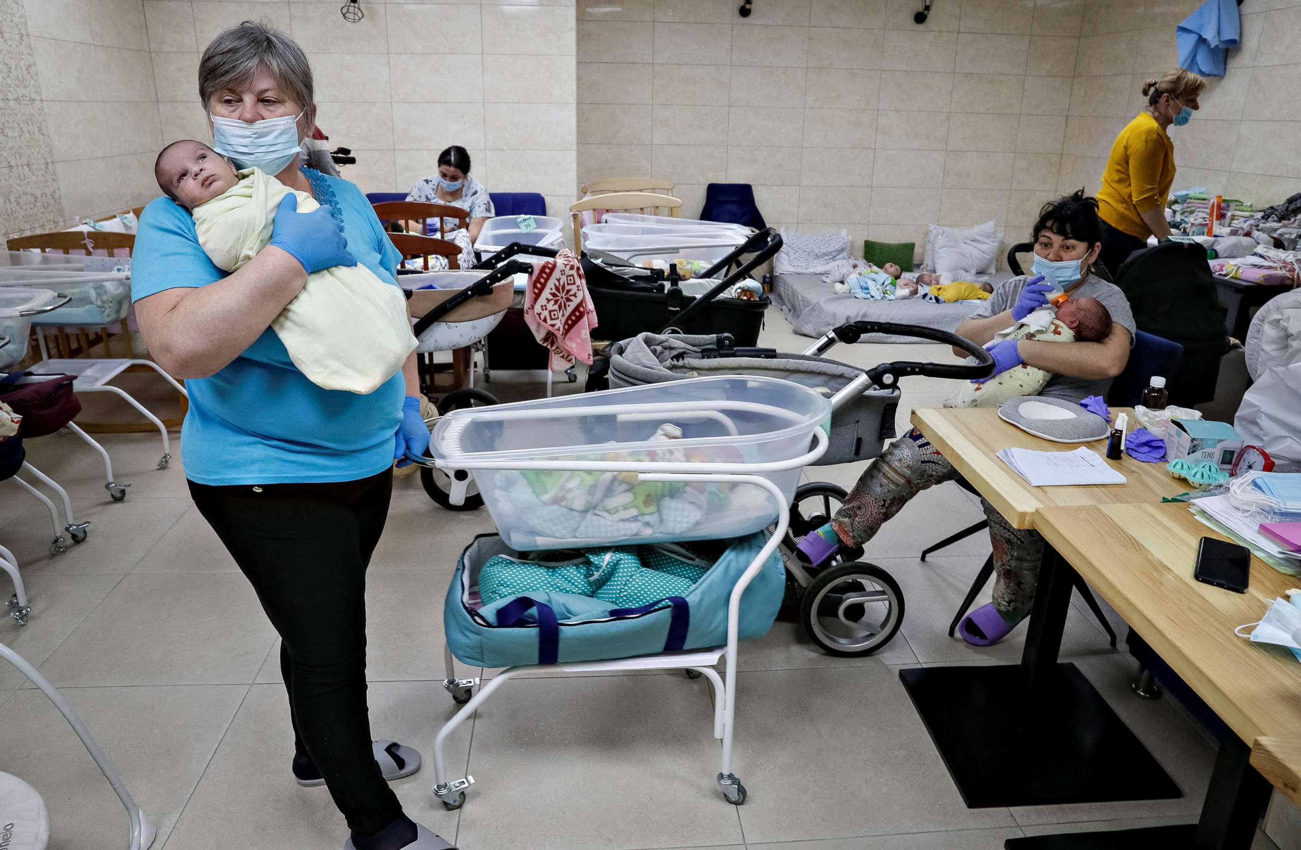PHOTO: Nurses look after surrogate-born babies inside a BioTexCom clinic shelter in a basement on the outskirts of Kyiv, Ukraine, March 15, 2022.