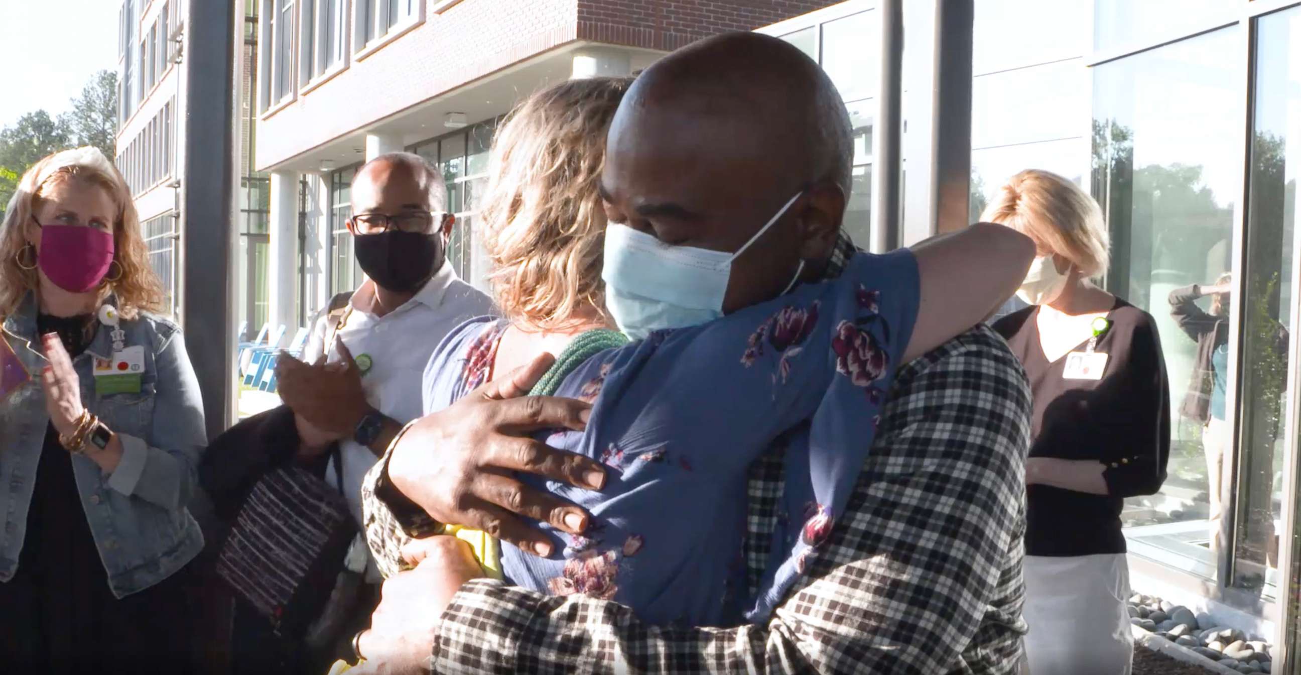 PHOTO: Tia Wimbush, right, hugs Susan Ellis at their welcome back surprise at Children's Healthcare of Atlanta.