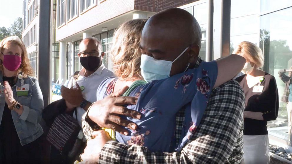 PHOTO: Tia Wimbush, right, hugs Susan Ellis at their welcome back surprise at Children's Healthcare of Atlanta.