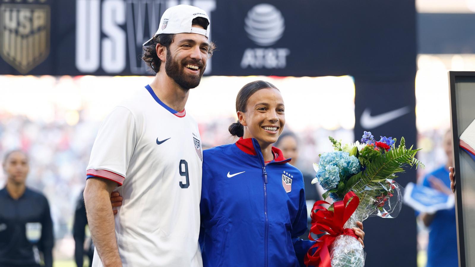 PHOTO: Mallory Swanson #9 of United States and her husband Dansby Swanson embrace prior to the match between USA and Iceland, Oct. 27, 2024, in Nashville, Tenn.
