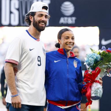 PHOTO: Mallory Swanson #9 of United States and her husband Dansby Swanson embrace prior to the match between USA and Iceland, Oct. 27, 2024, in Nashville, Tenn.