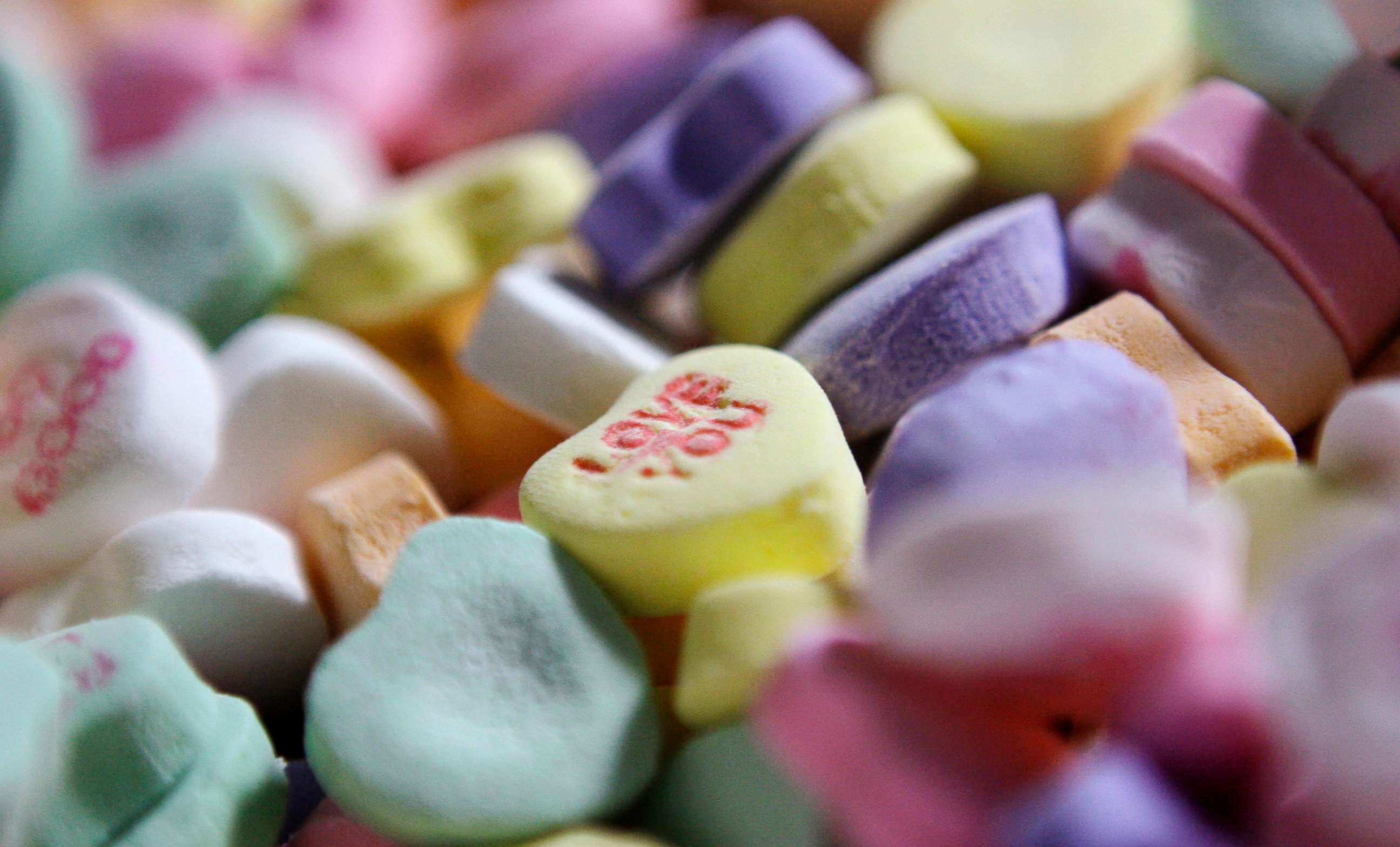 PHOTO: Colored "Sweethearts" candy is held in bulk prior to packaging at the New England Confectionery Company in Revere, Mass., Jan. 14, 2009.