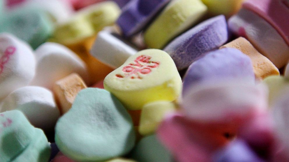 PHOTO: Colored "Sweethearts" candy is held in bulk prior to packaging at the New England Confectionery Company in Revere, Mass., Jan. 14, 2009.