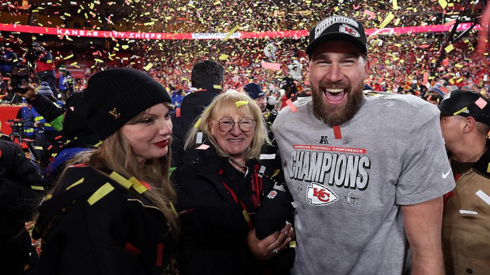 PHOTO: Travis Kelce celebrates with Taylor Swift and mother Donna Kelce after the Chiefs won the AFC Championship Game at GEHA Field at Arrowhead Stadium on January 26, 2025 in Kansas City, Missouri.