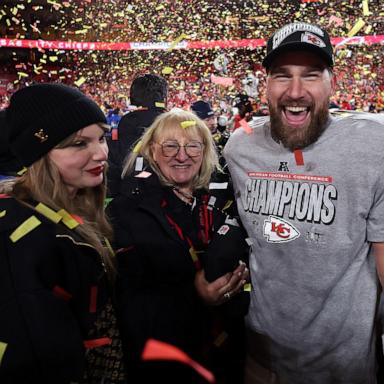 PHOTO: Travis Kelce celebrates with Taylor Swift and mother Donna Kelce after the Chiefs won the AFC Championship Game at GEHA Field at Arrowhead Stadium on January 26, 2025 in Kansas City, Missouri.