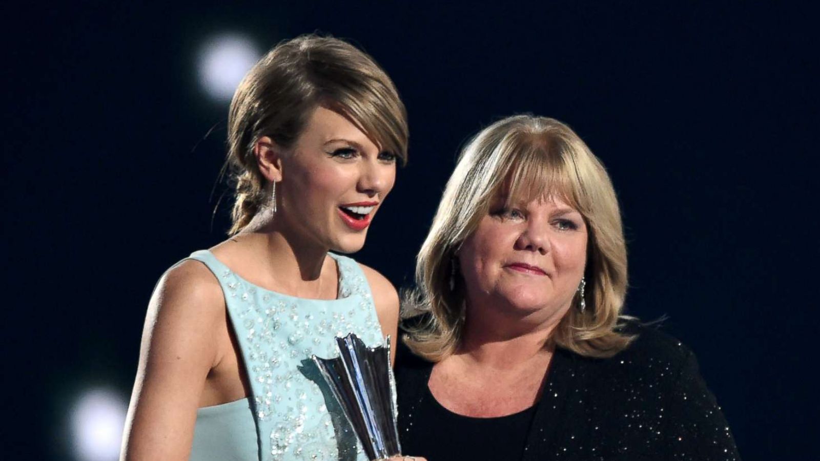 PHOTO: Taylor Swift accepts the Milestone Award from Andrea Swift onstage during the 50th Academy Of Country Music Awards, April 19, 2015, in Arlington, Texas.