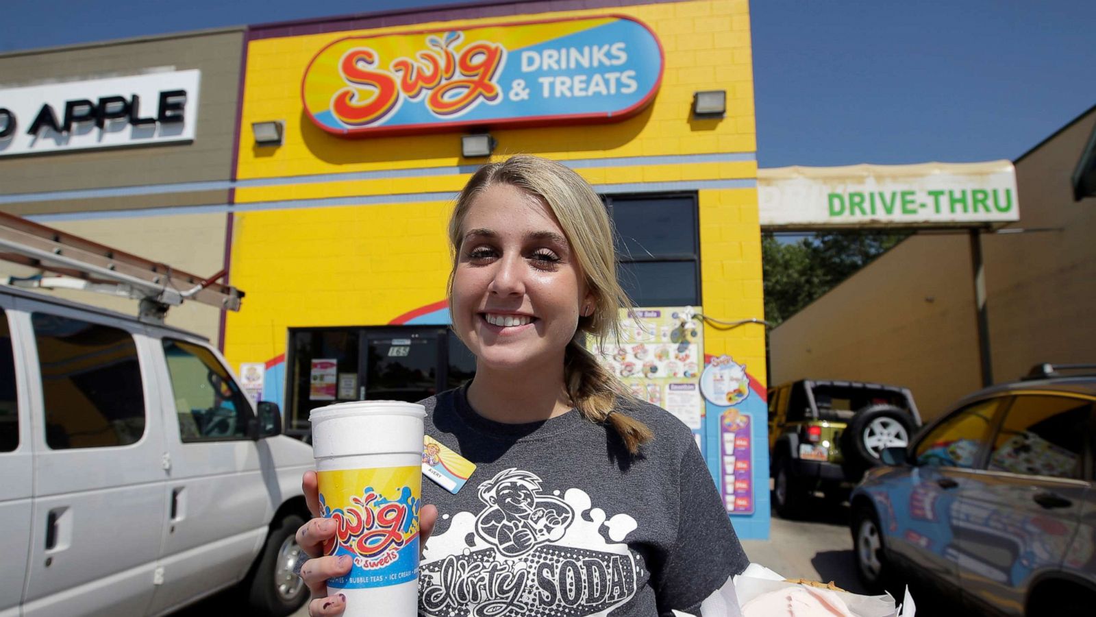 PHOTO: In this Aug. 4, 2016, file photo, Swig soda shop employee Avery Griffiths poses for a photo with a "dirty soda," in Bountiful, Utah.