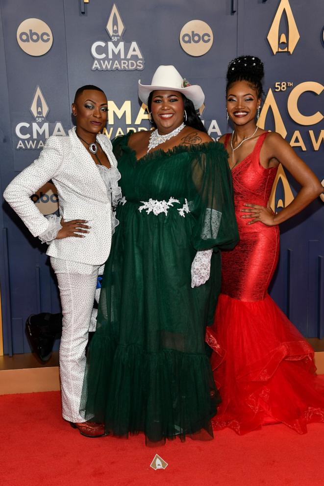 PHOTO: Trea Swindle, from left, Danica Hart and Devynn Hart, of musical group Chapel Hart, arrive at the 58th Annual CMA Awards, Nov. 20, 2024, in Nashville, Tenn. 