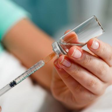 PHOTO: Stock photo of a person filling a syringe.