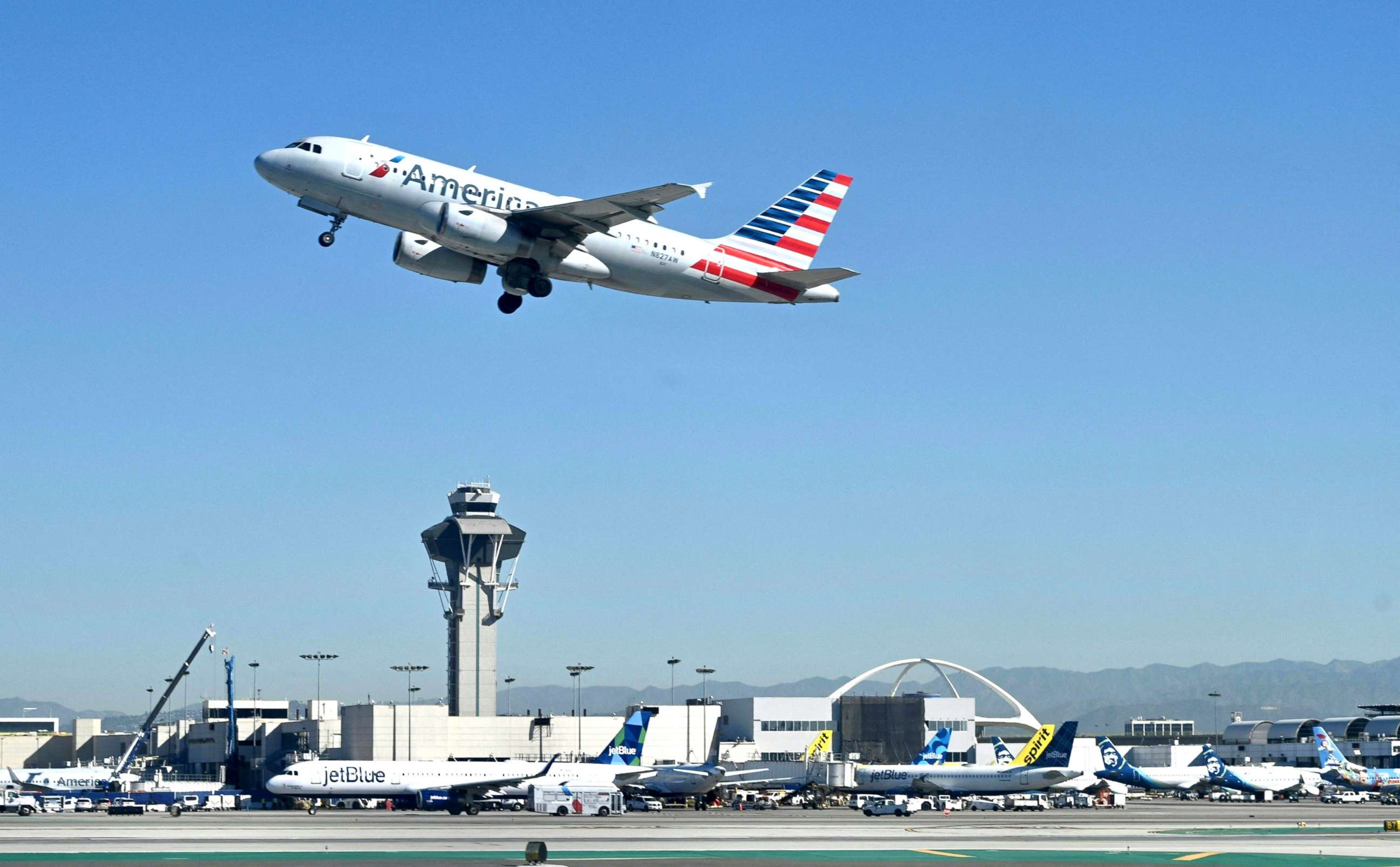 PHOTO: An American Airlines Airbus 319 plane takes off from the Los Angeles International Airport (LAX) on March 23, 2022.