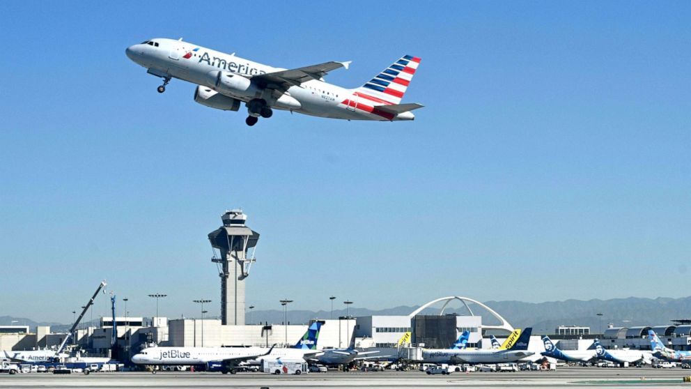 PHOTO: An American Airlines Airbus 319 plane takes off from the Los Angeles International Airport (LAX) on March 23, 2022.