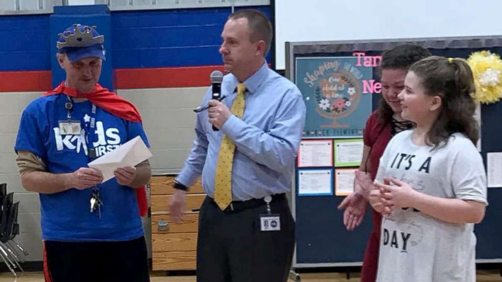 PHOTO: From left, Tamarack Elementary School head custodian Ricky Young poses with Superintendent Matt Robbins, Layliana Calmese and Addilyn Simpson.