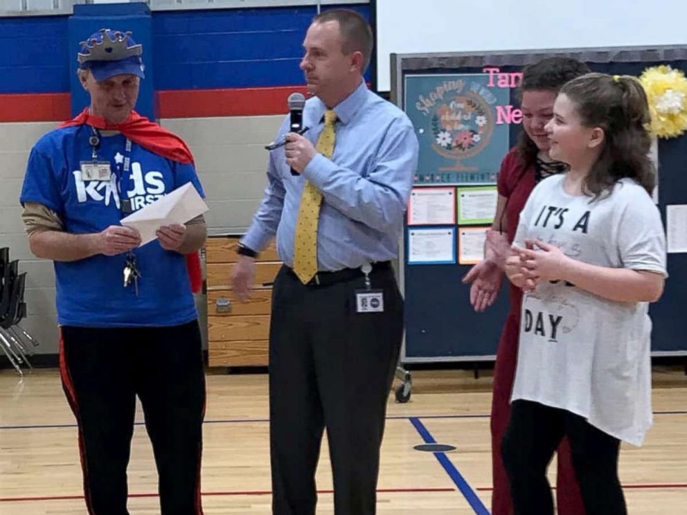 PHOTO: From left, Tamarack Elementary School head custodian Ricky Young poses with Superintendent Matt Robbins, Layliana Calmese and Addilyn Simpson.