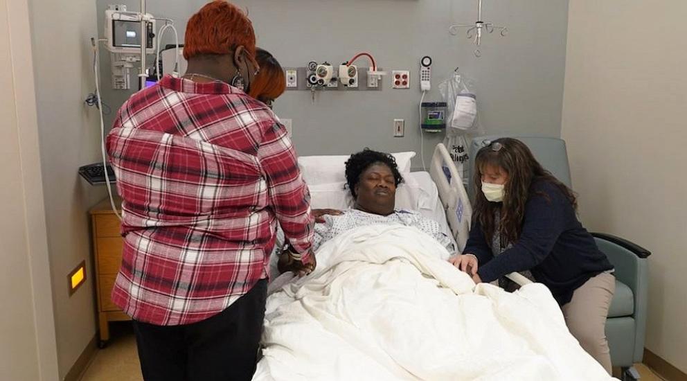 PHOTO: Tammy Edwards prays with family members and friends before undergoing a kidney transplant at ECU Health.