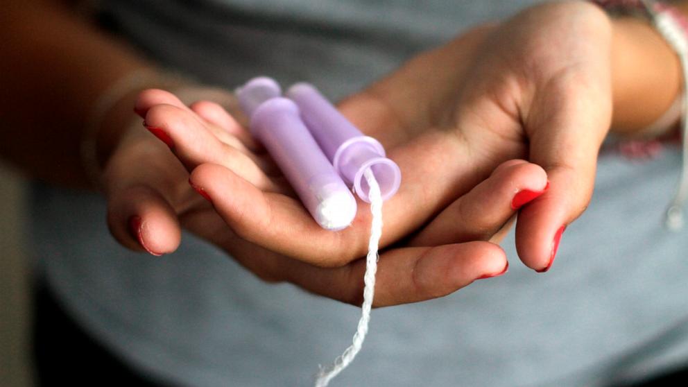 PHOTO: A women holds a tampon in this undated stock photo.