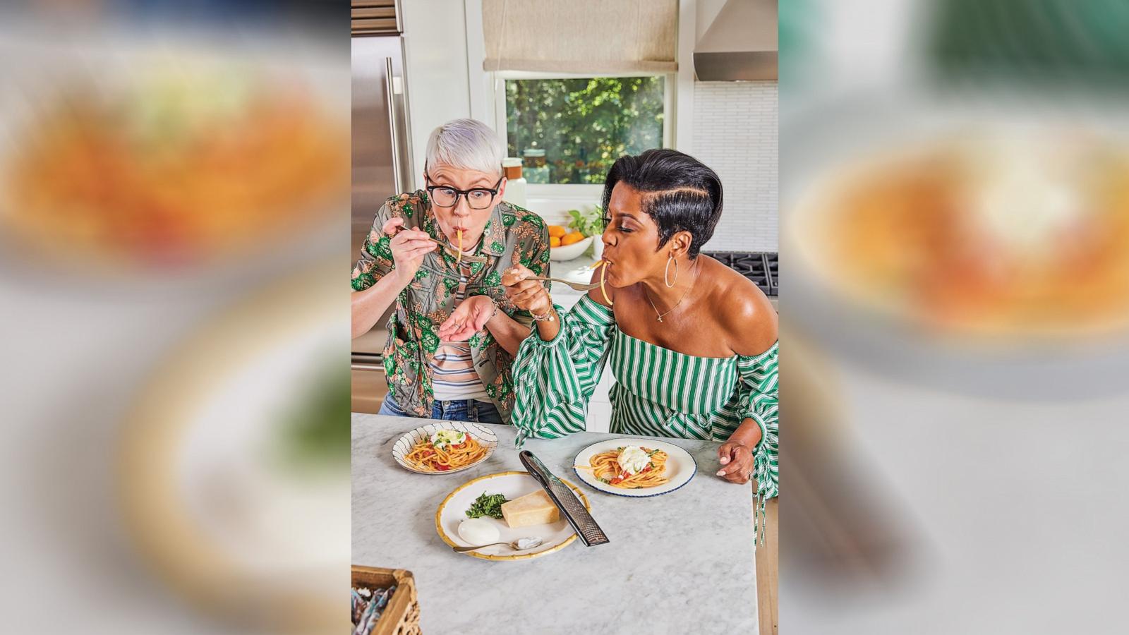 PHOTO: Tamron Hall, right, and co-author Lish Steiling taste recipes from their new cookbook "A Confident Cook: Recipes for Joyous, No-Pressure, Fun in the Kitchen."