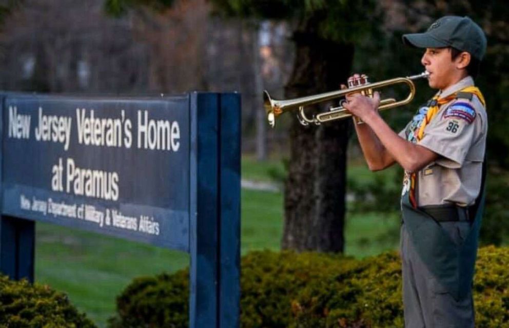 PHOTO: Alex Saldana, 13, plays "Taps" outside a New Jersey nursing home for veterans every night since April 8th.