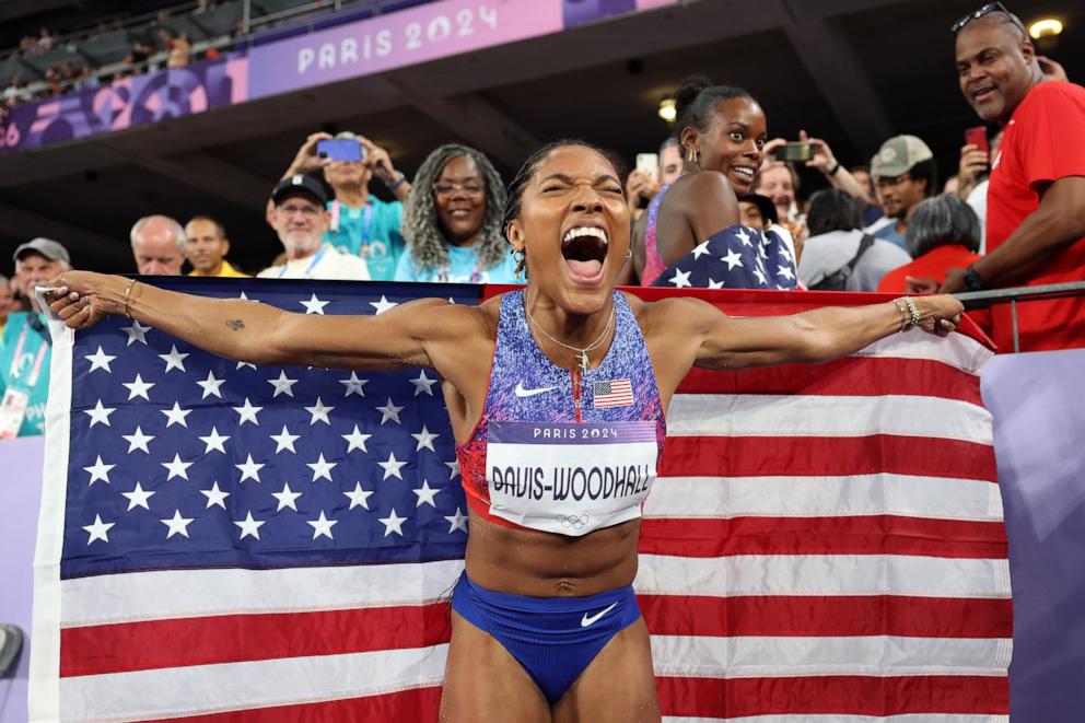 PHOTO: Tara Davis-Woodhall of Team United States celebrates winning the gold medal after competing in the Women's Long Jump Final on day thirteen of the Olympic Games Paris 2024 at Stade de France on Aug. 8, 2024 in Paris.