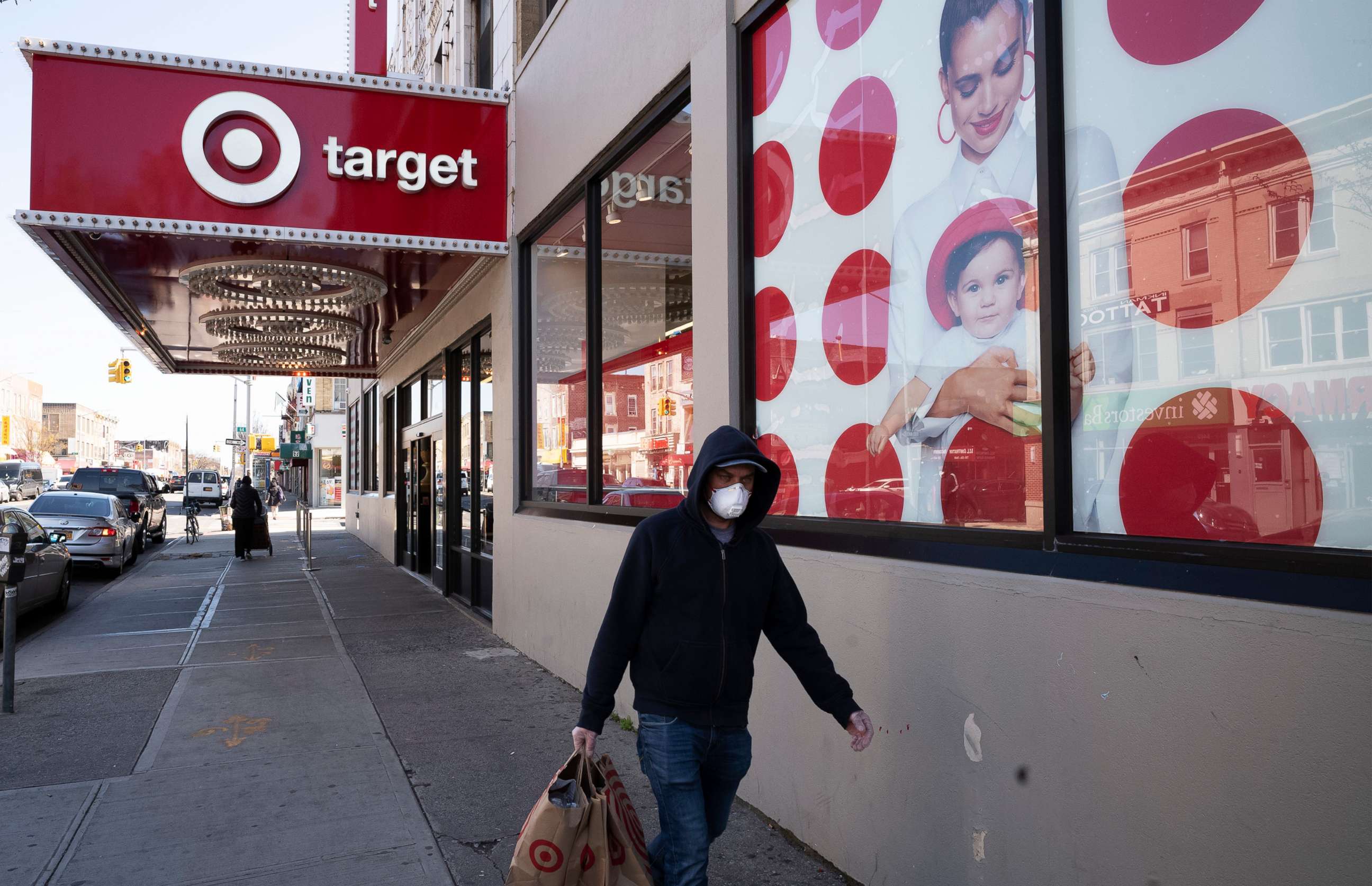 PHOTO: A customer wearing a mask carries his purchases as he leaves a Target store during the coronavirus pandemic, Brooklyn, N.Y., April 6, 2020.