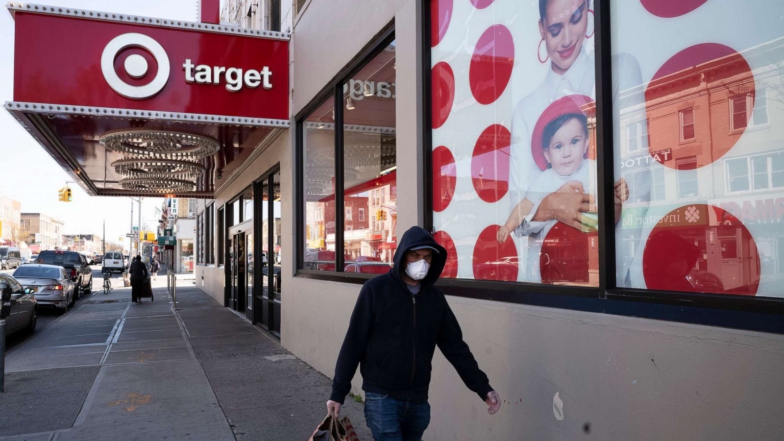 PHOTO: A customer wearing a mask carries his purchases as he leaves a Target store during the coronavirus pandemic, Brooklyn, N.Y., April 6, 2020.