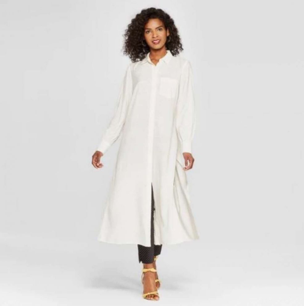 PHOTO: Step out in an extended white tunic that lets you do the dress-over- jeans-trend comfortably and effortlessly. Add heels to lengthen your legs and let the tunic flow. (We love it with the yellow sandals on this list).