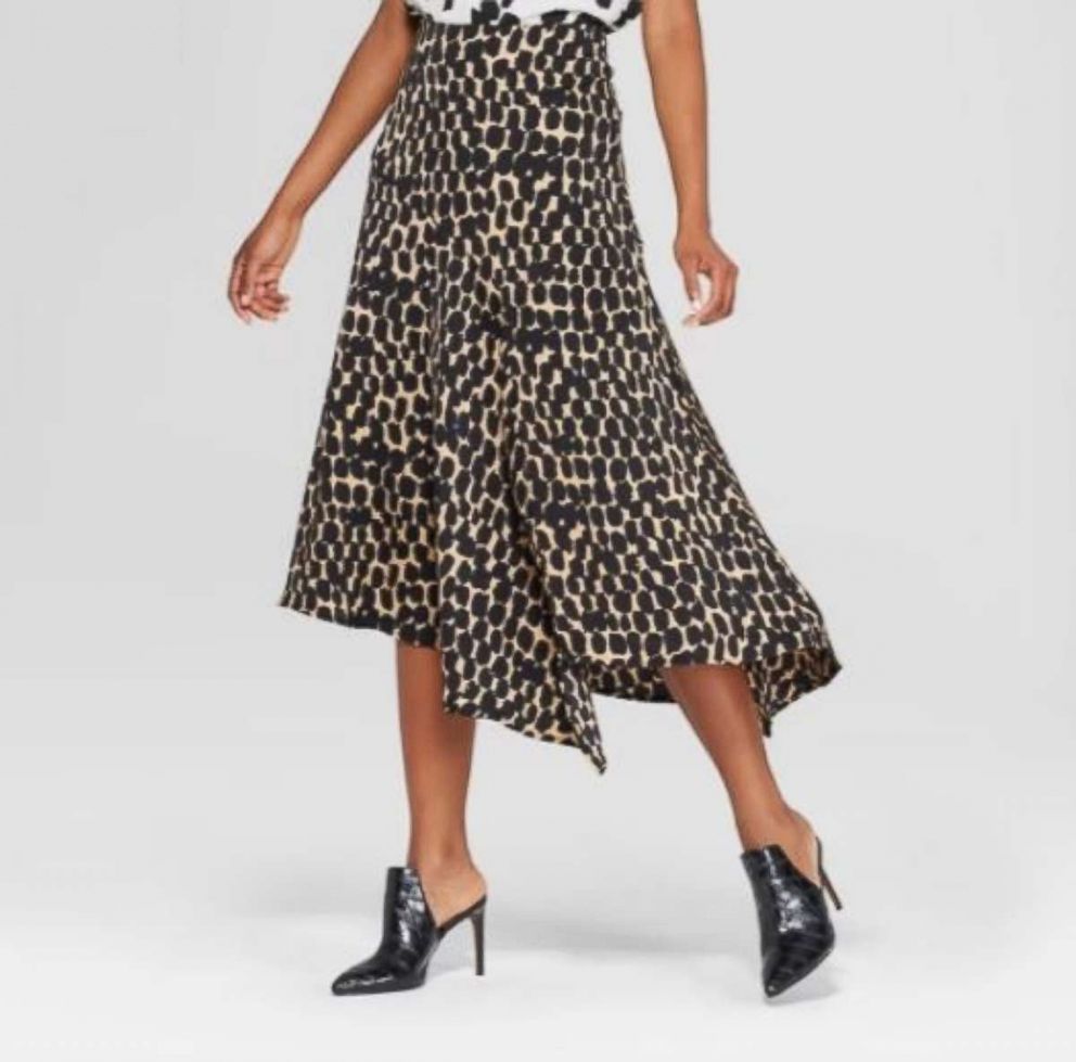 PHOTO: If you buy one leopard item this fall, make it this skirt. The asymmetric hem feels floaty and relaxed and plays well with everything. One trend we are loving is mixing leopard with textured leather.