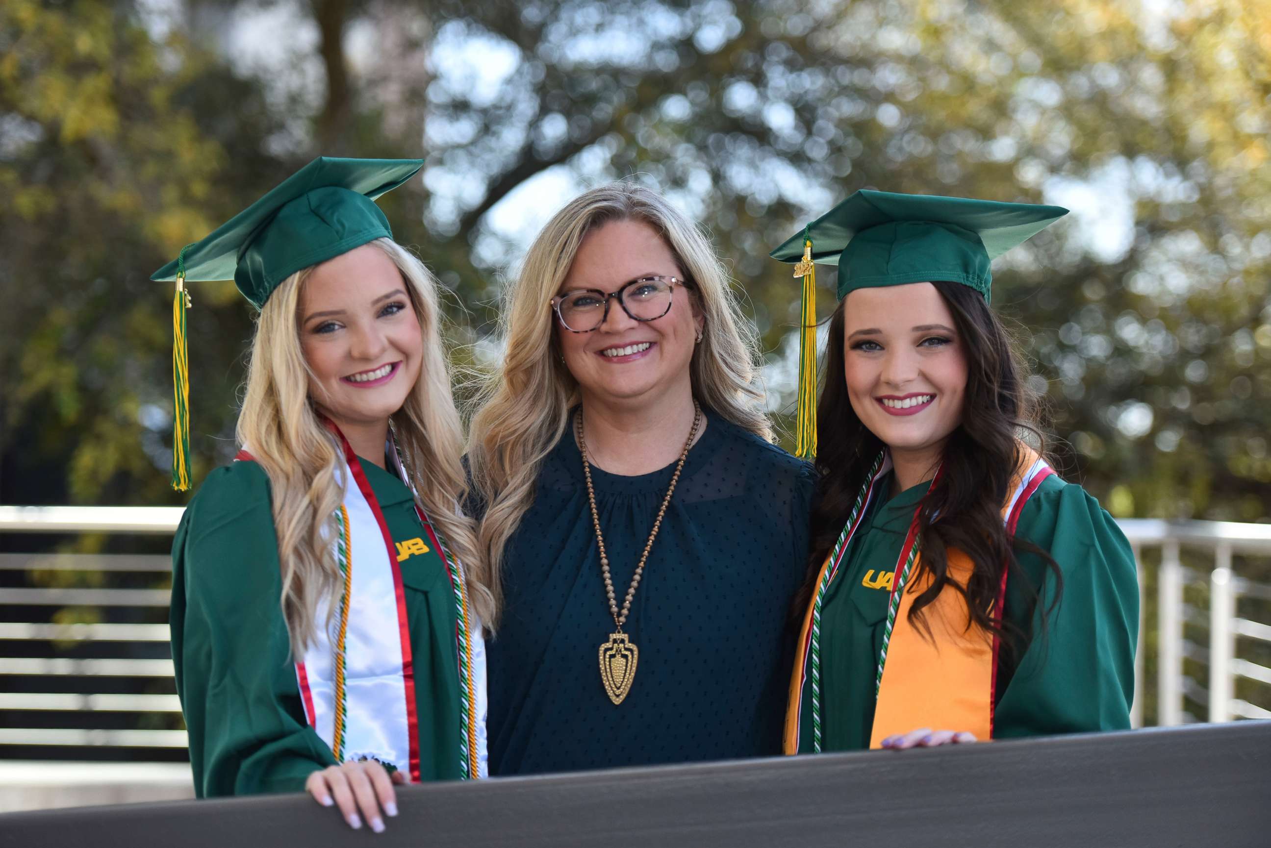 PHOTO: Tara Wood (center) with her twin daughters, Taylor England and Jade England, who both graduated from the University of Alabama at Birmingham this spring.