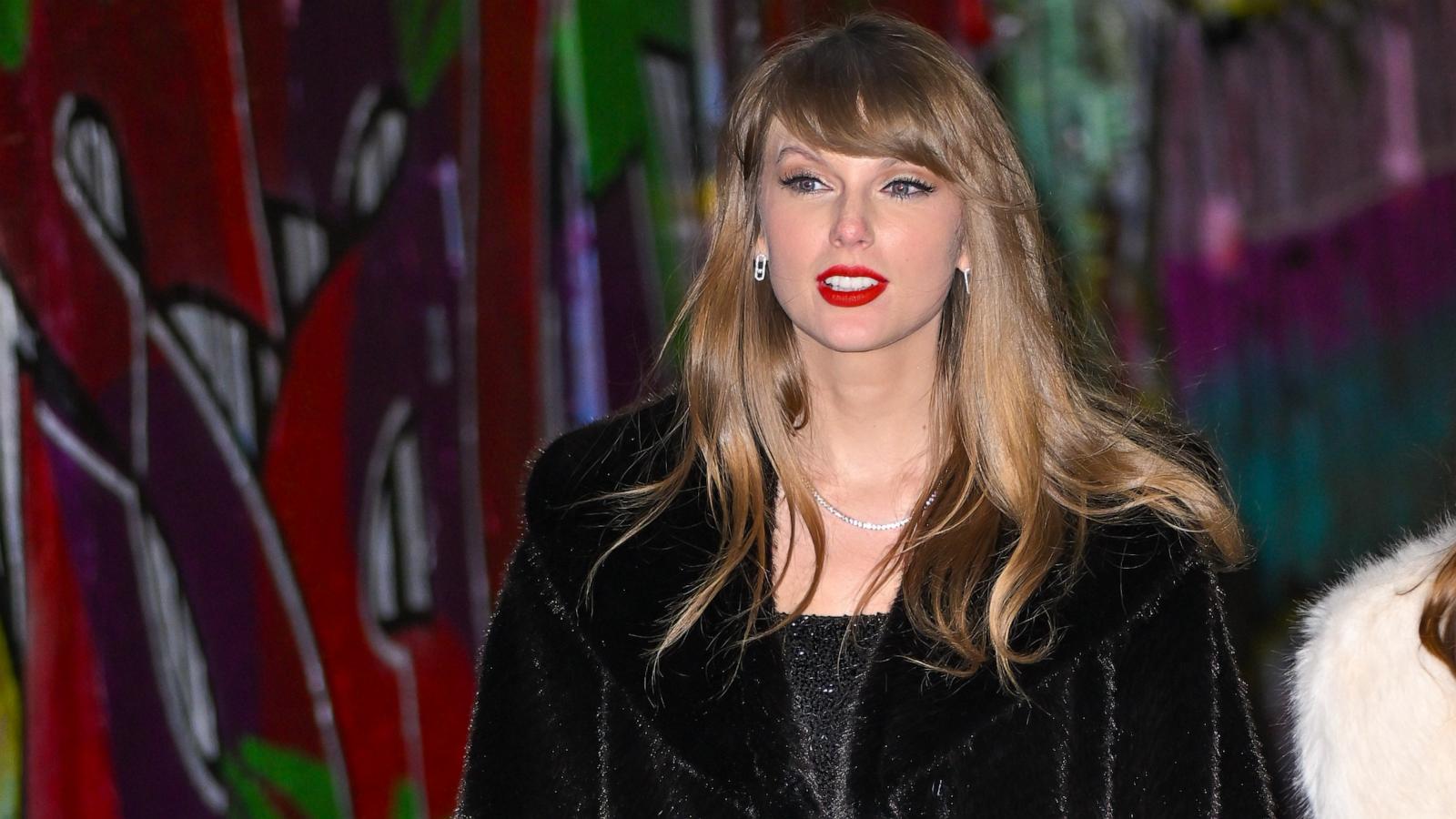 Taylor Swift steps out in sparkling little black dress for her