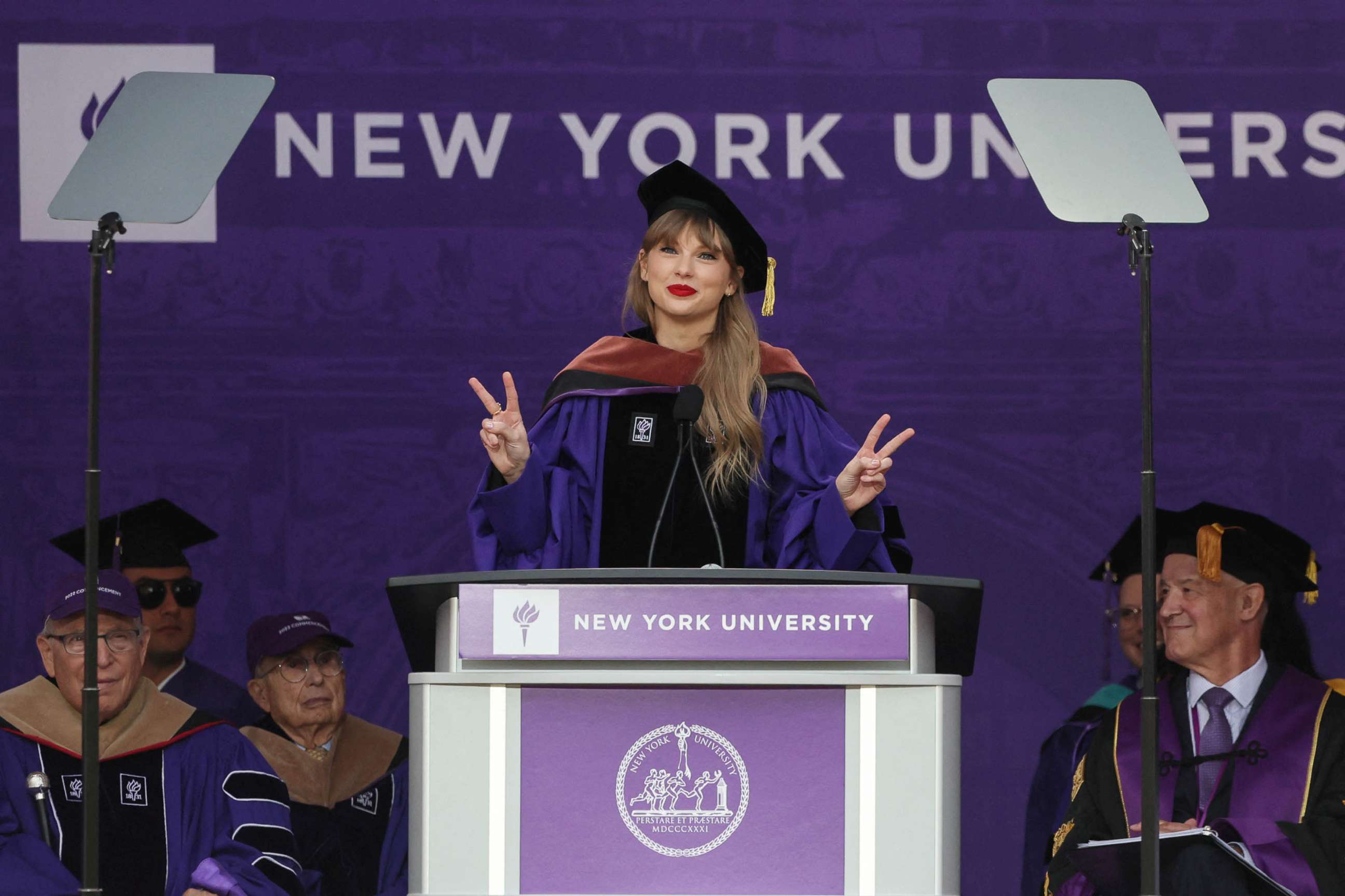 PHOTO: Singer Taylor Swift gestures while speaking after receiving her Honorary Doctorate in Fine Arts during the New York University graduation ceremony at Yankee Stadium in New York, May 18, 2022.